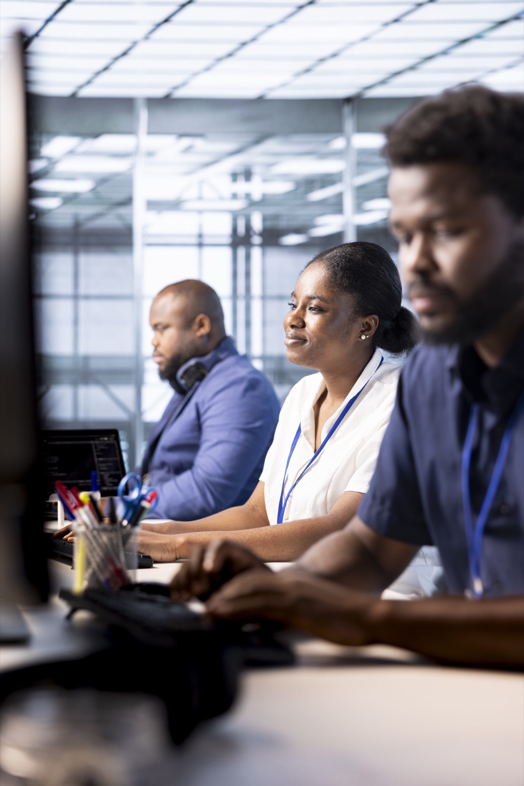 Data centre operations team working at their monitors